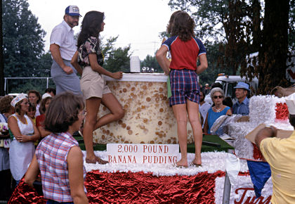 Great legs waiting to serve the 1-ton pudding at the 1981 Banana Festival, Fulton KY - S. Fulton TN