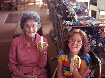Two generations enjoy their bananas at the 1981 Banana Festival in Fulton KY - S. Fulton TN