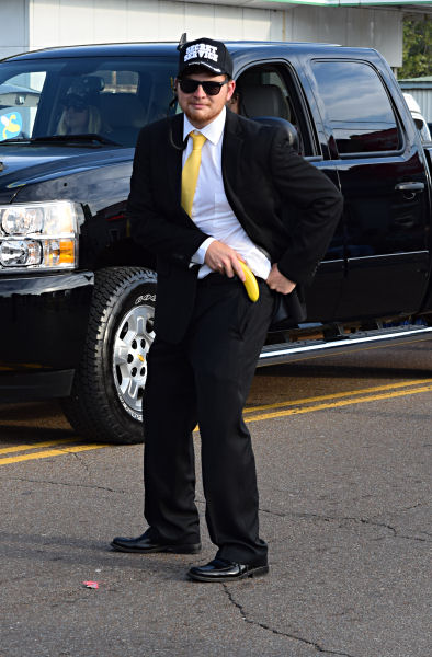 Secret Service agent draws his banana to protect President Banana, 2014 Banana Festival parade