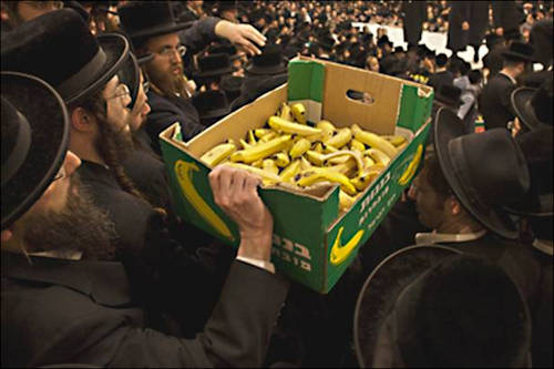 Jewish men with a box of bananas at the Belz yeshiva on Tu Bishvat day, the Jewish arbor day.